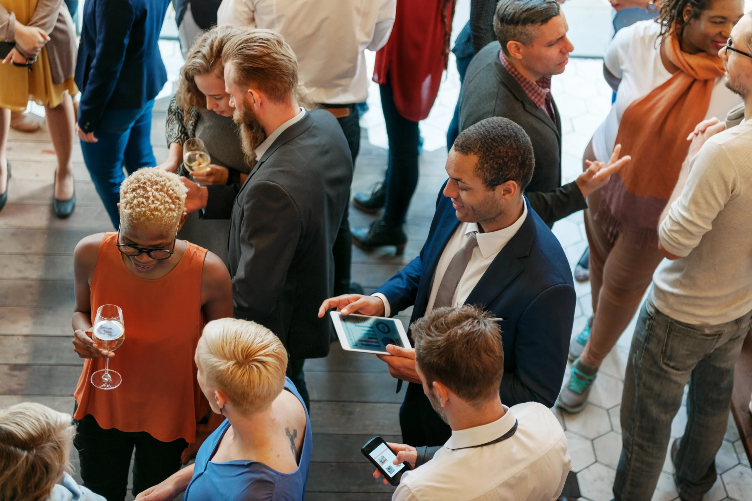 The Future of Brand Engagement: How Live Experiences Are Driving Business Growth diverse professionals networking and socializing at an event